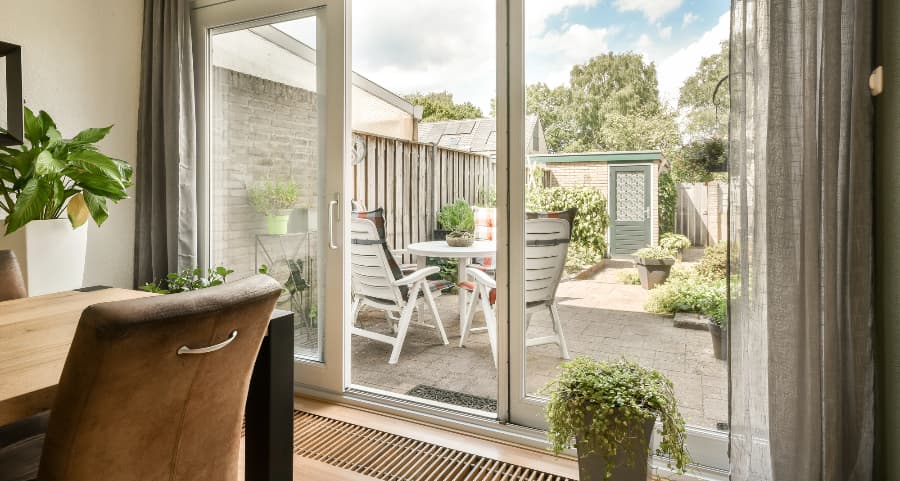 Sliding glass door connecting home to a back patio
